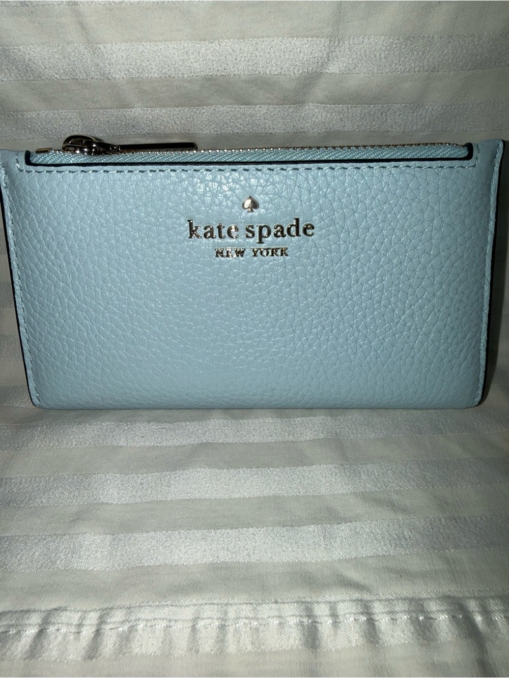 kate spade light blue pebbled leather zip-around wallet